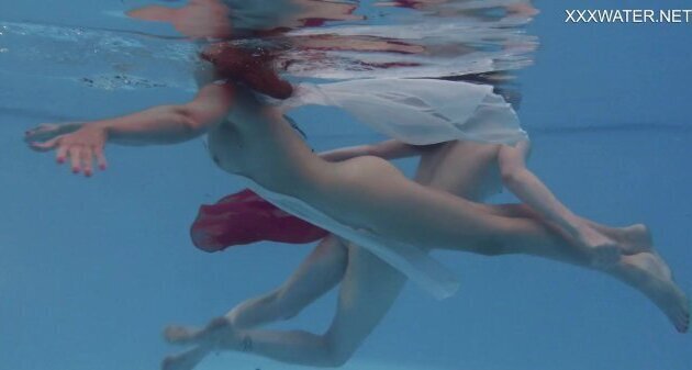 Girlfriends enjoy swimming naked together