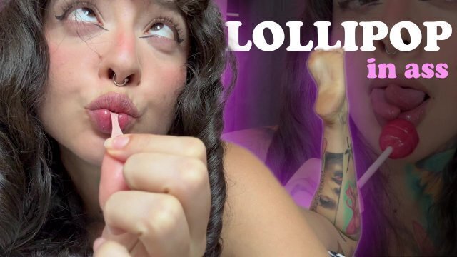 Girl with split tongue licks lollipop puts