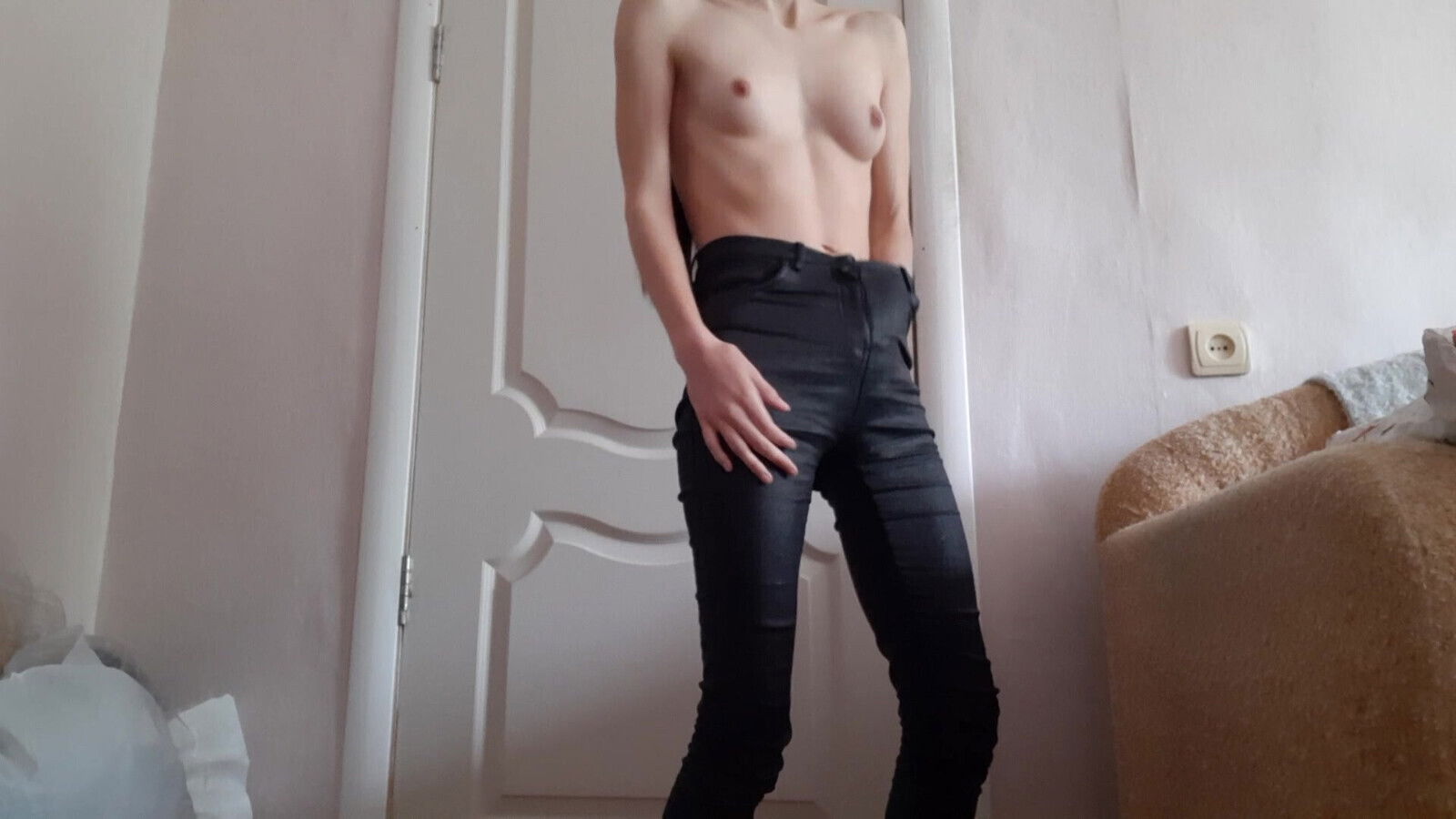 Skinny girl masturbates leather pants
