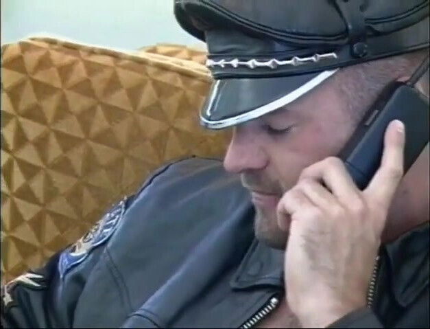 Handsome police officer with leather