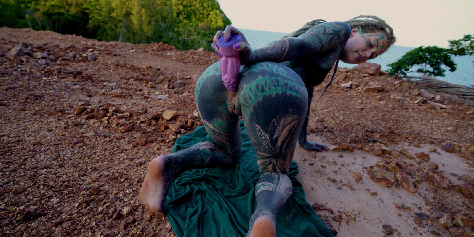 Inked cutie plays with public lets flow