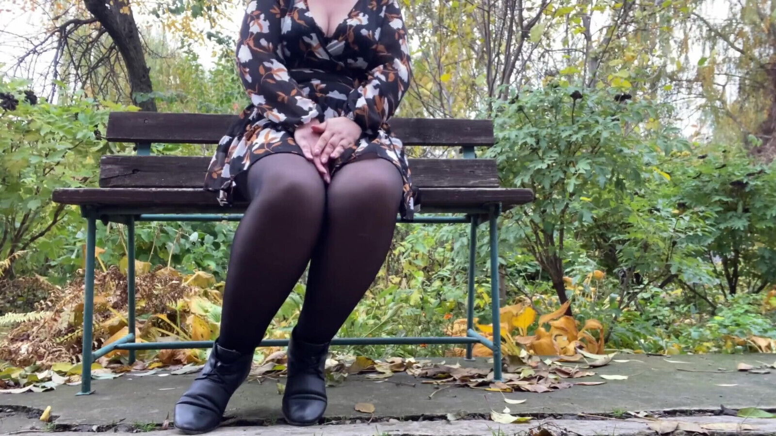 Mature stepmother undresses outdoors