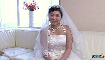 asian wife still dressed wedding gown when someone visited