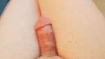 Sweet holding tiny cupcake with pink frosting