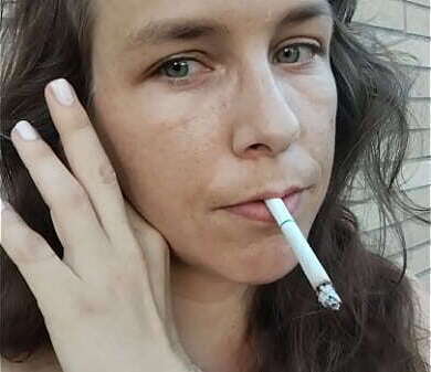 Kelly Kendricks smokes cigarettes with lots cleavage