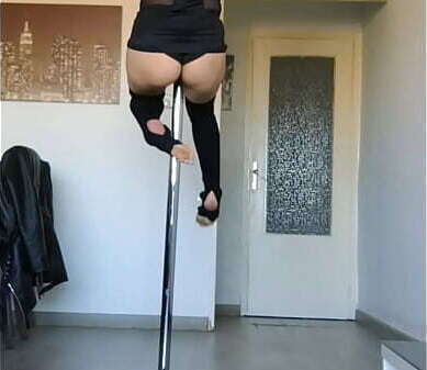 Miss amateur stripper dances, moving hips body while rubbing against