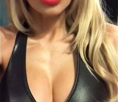 Sexy blonde tight leather catsuit