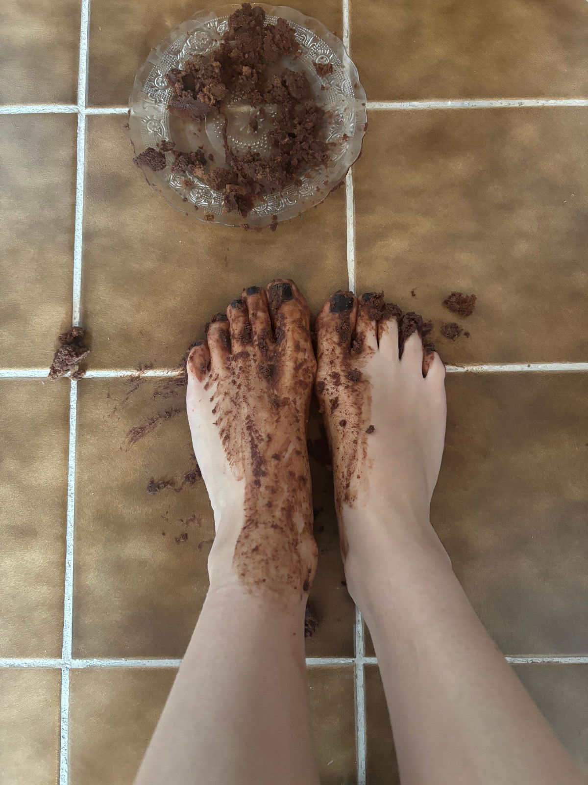 Destroying chocolate cake with feet