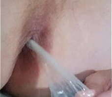 Playing with a condom in my ass