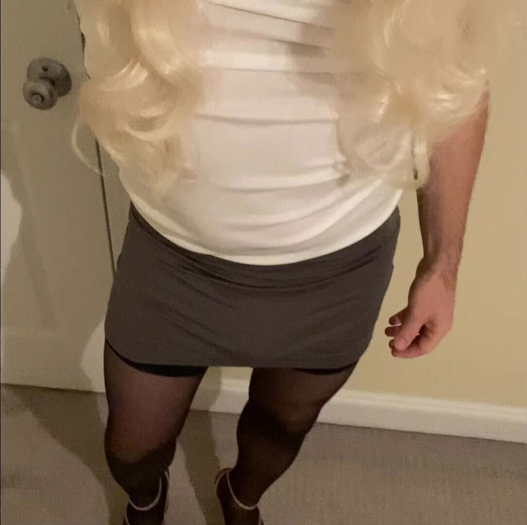 Crossdresser flaunting by walking around in short skirts and dresses, heels and stockings trying to arouse cocks and shemales
