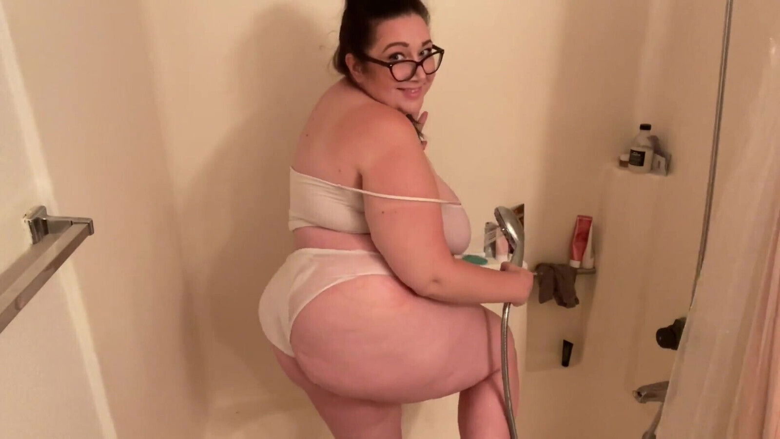 Busty BBW babe gets soaked in the shower