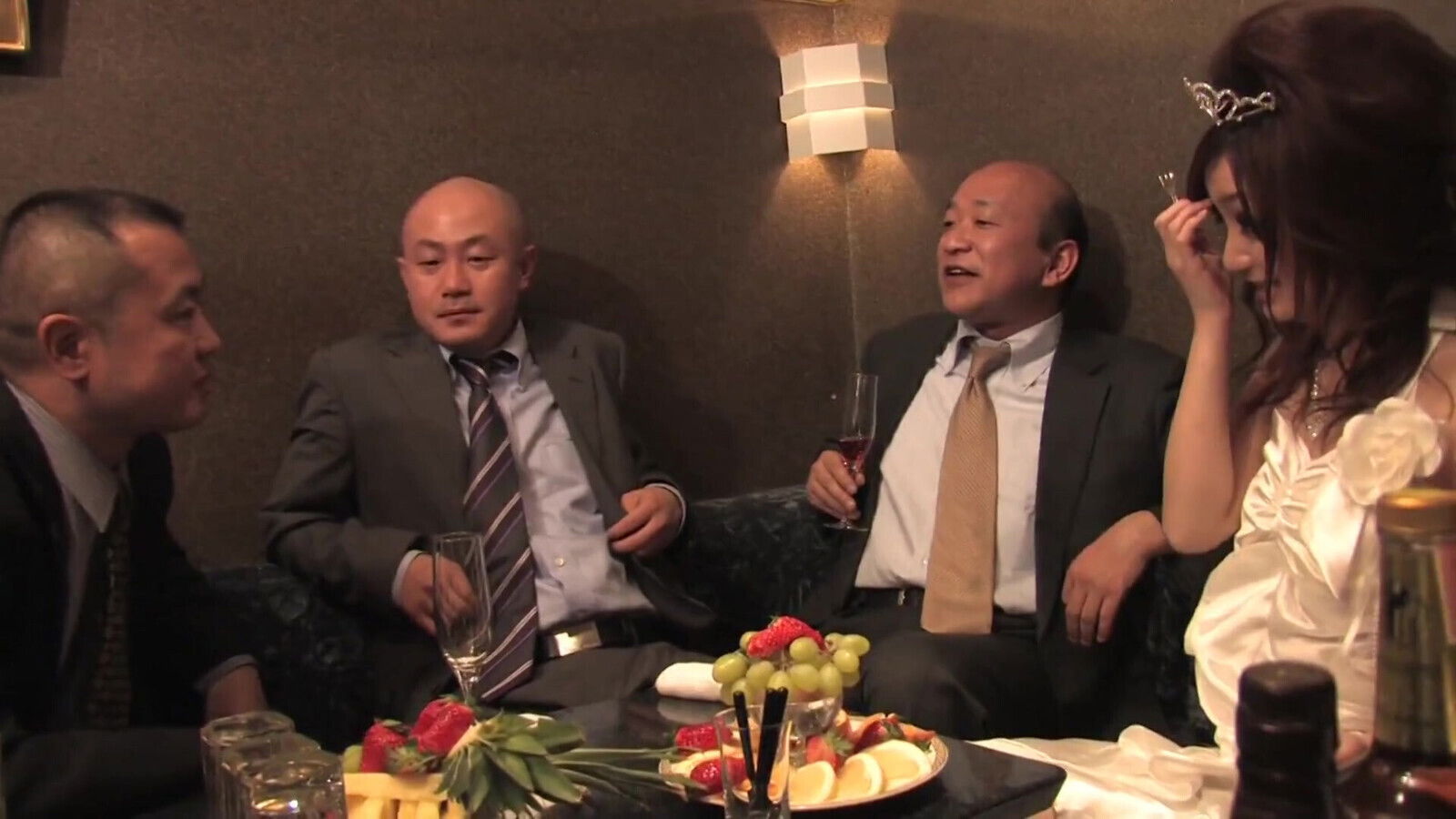 Cute Japanese Slut Servicing Three Guys in the Club