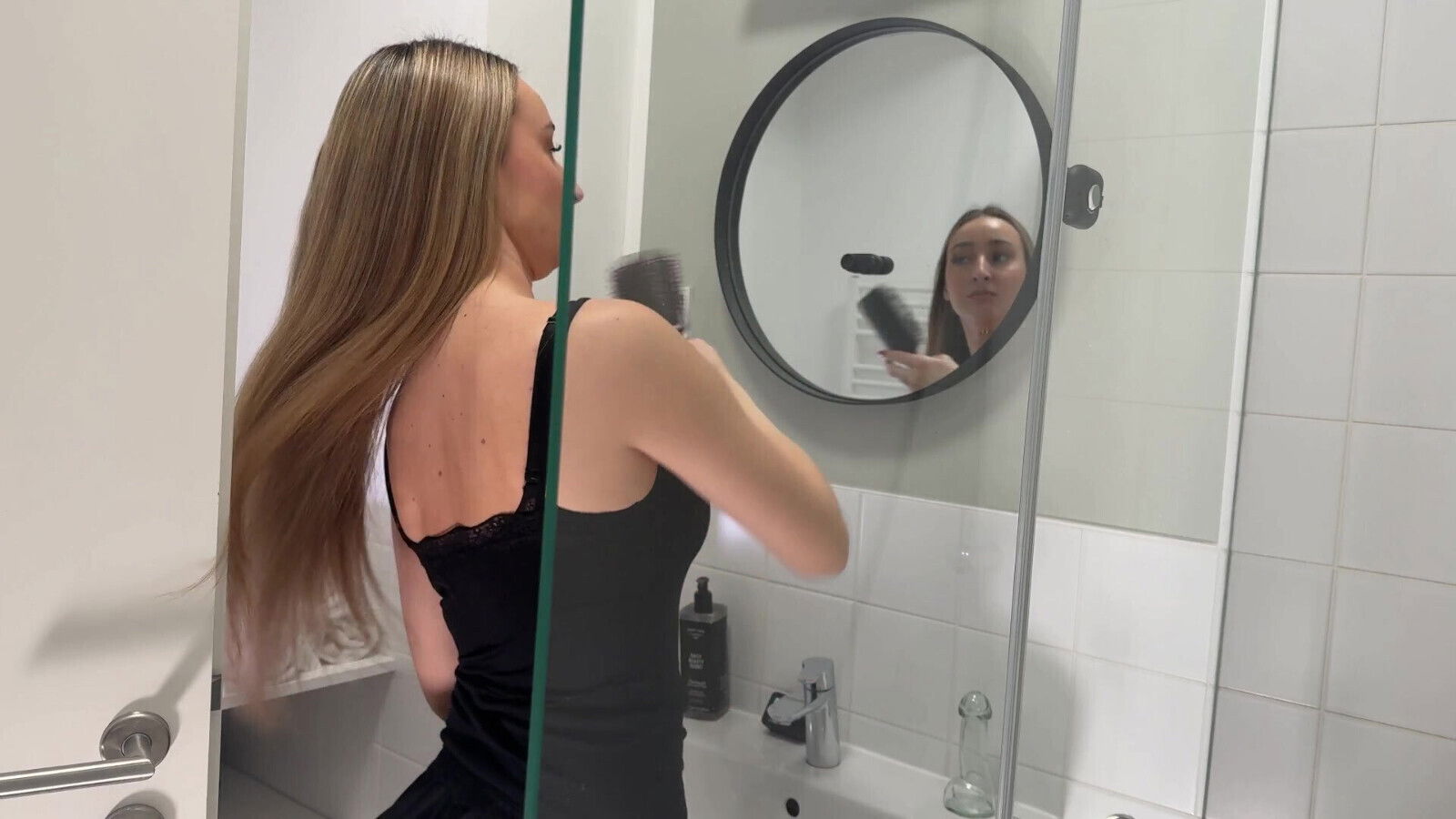 Amazingly beautiful college girl in the bathroom with a super skirt miniskirt shows her ass