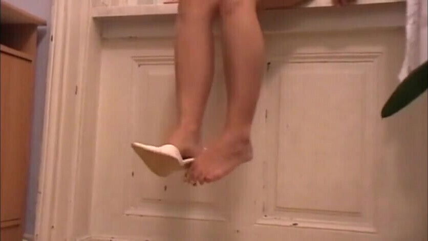 Dangling in white heels