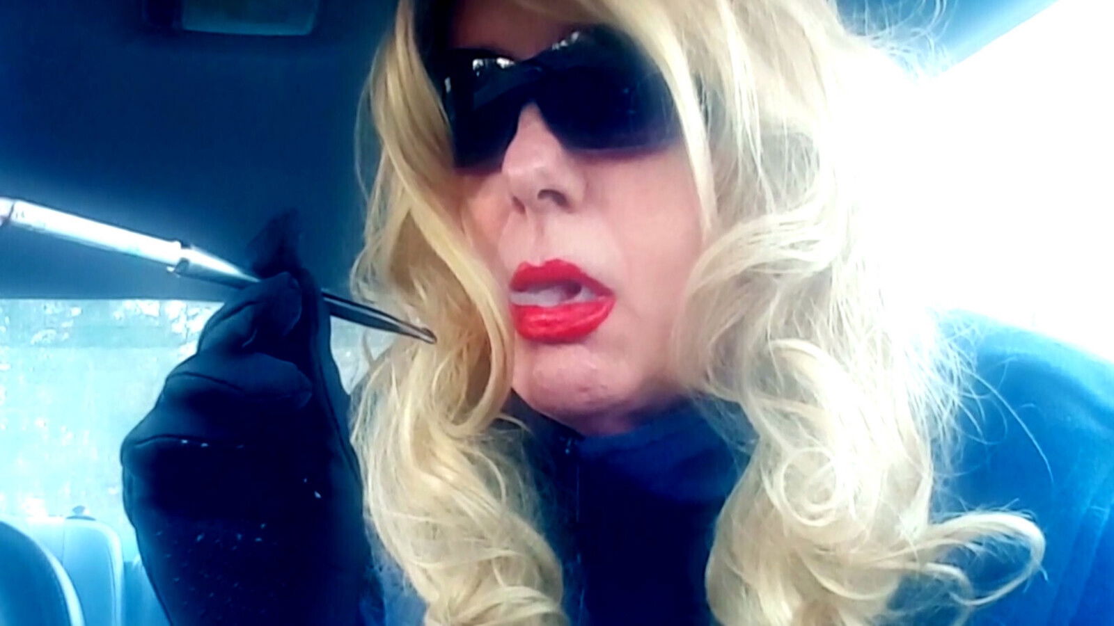 A BLONDE MRS. RUTHIE ROMAN MATURE SMOKING VS120's IN A CIGARETTE HOLDER