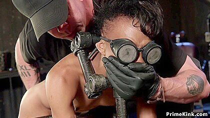 Slim Ebony Sub In Doggy Metal Device With Nikki Darling