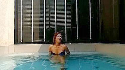 Sexy Brunette Babe Teasing Herself In The Pool