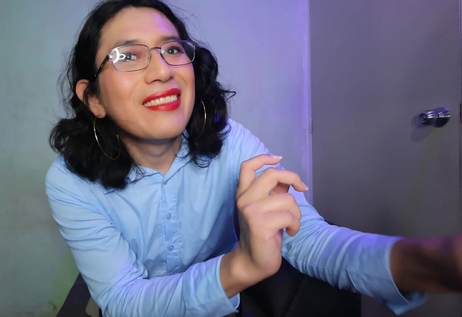 With two dildos in his mouth.