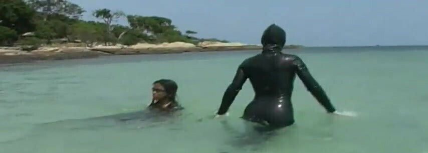 Swimming in the ocean with ebony babe