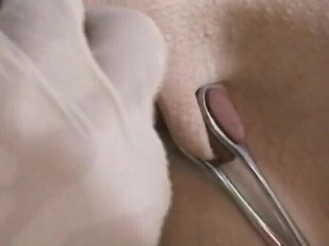 Skinny girl gets pussy pinched while she's tied down