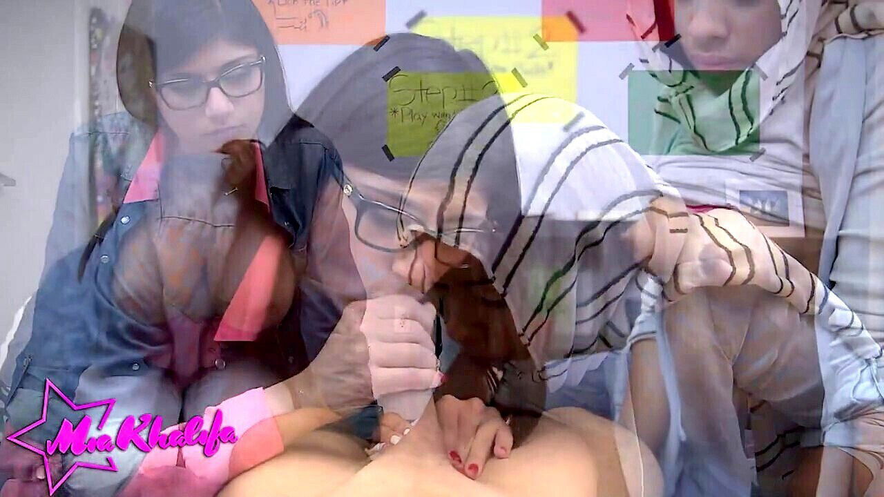 Busty brunette Mia Khalifa shows Valentina Vega how to give an epic blowjob