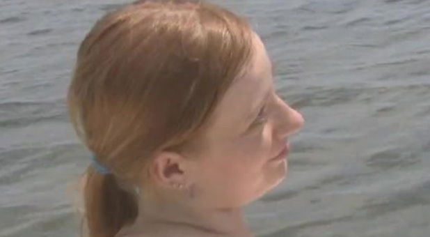 Fabulous amateur babe with natural tits giving a handjob on a boat