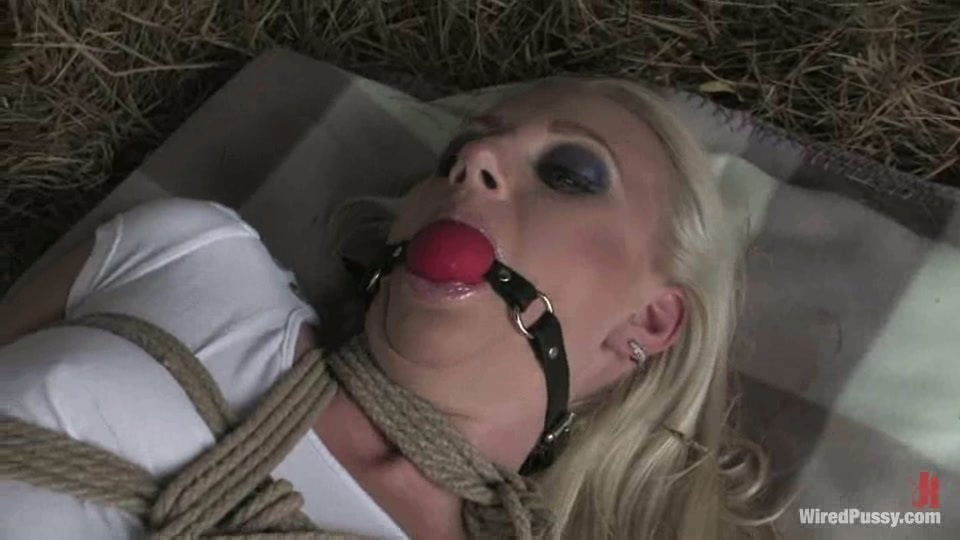 Erika Angel gets tormented and fucked by a chubby brunette in a barn