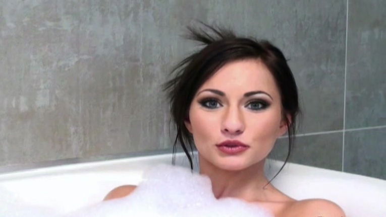 Isizzu is lying naked in soapy bath