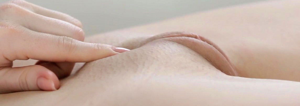 Sweet blonde Sara Redz lying touching pussy