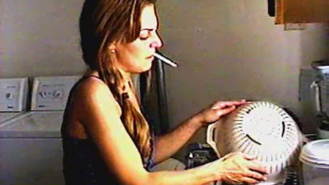 Cute chick smokes around house