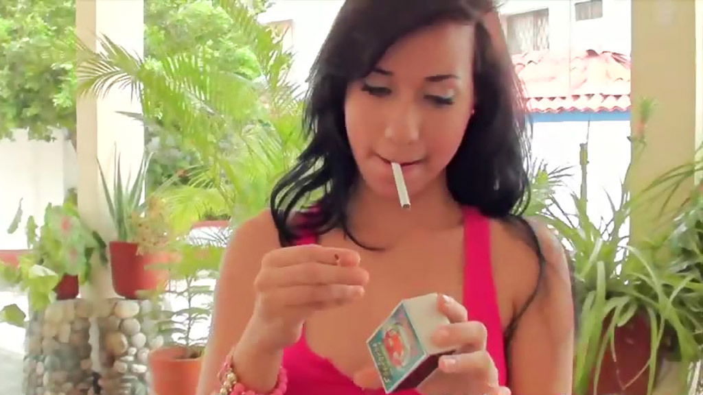 Cutie braces smokes cigarette outdoors