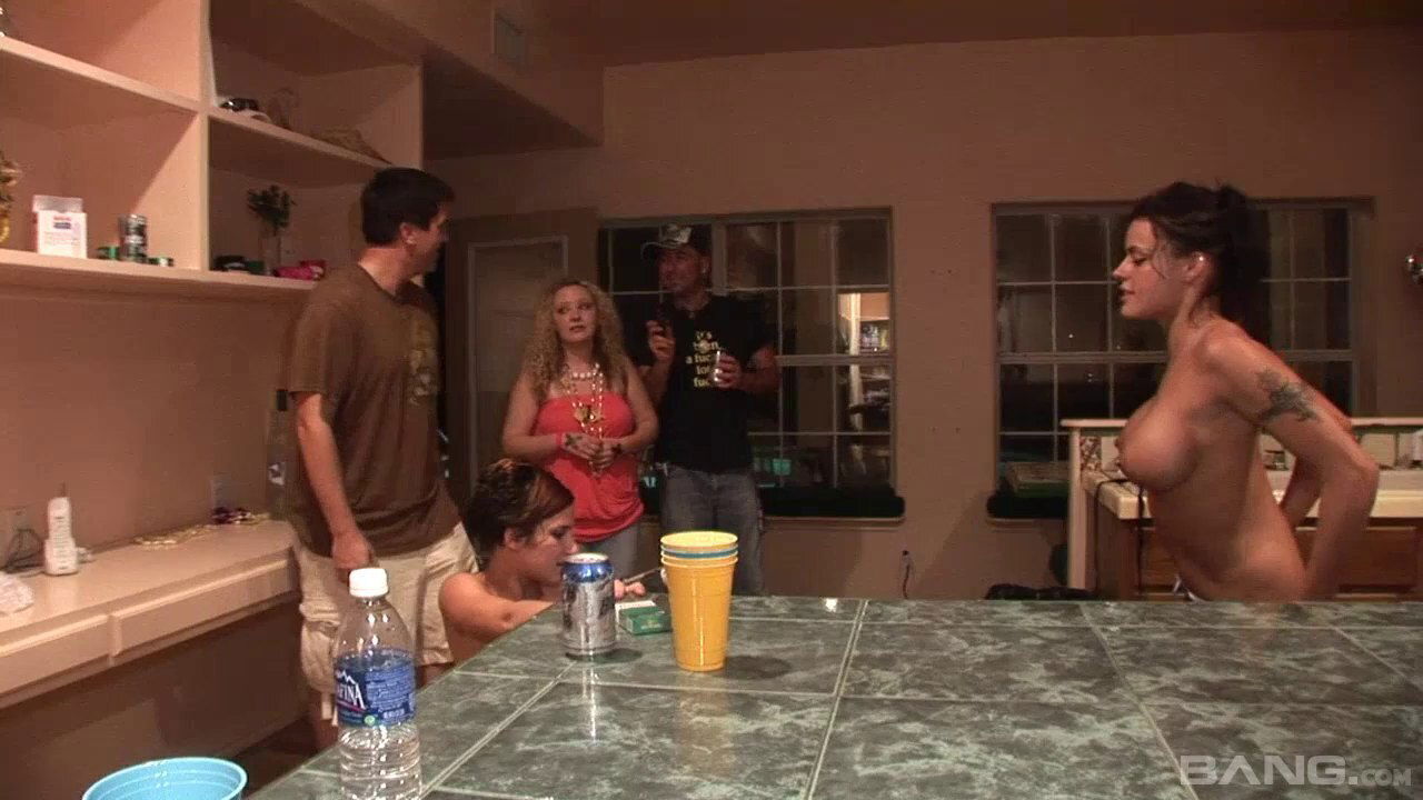 Busty ladies showing off their boobs inside the kitchen