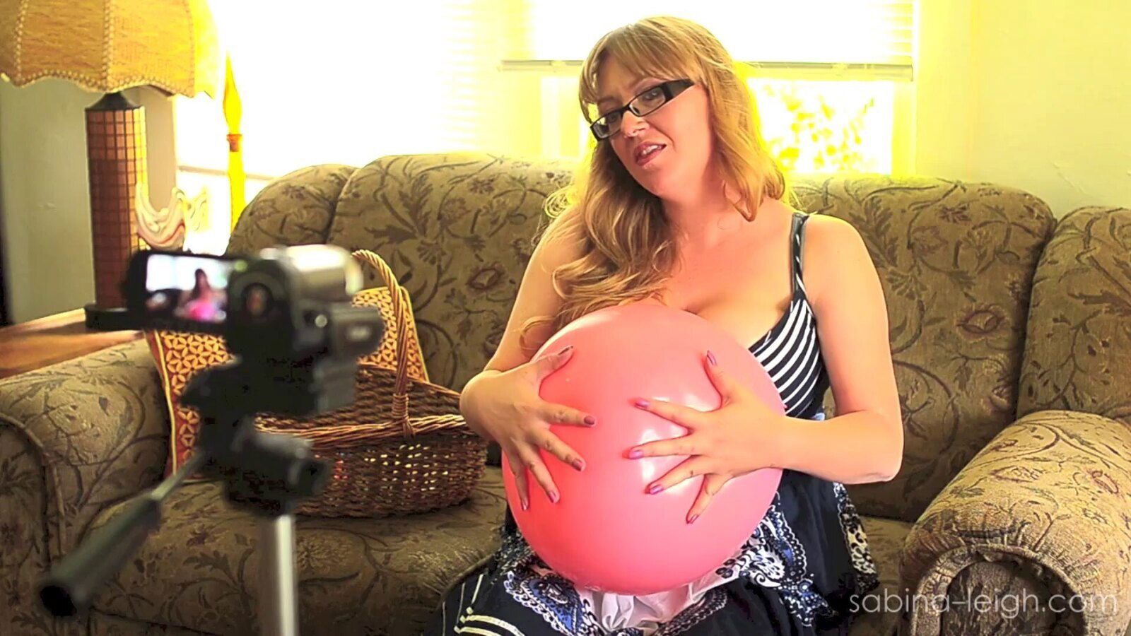 Busty blonde Sabina Leigh shows cleavage solo video