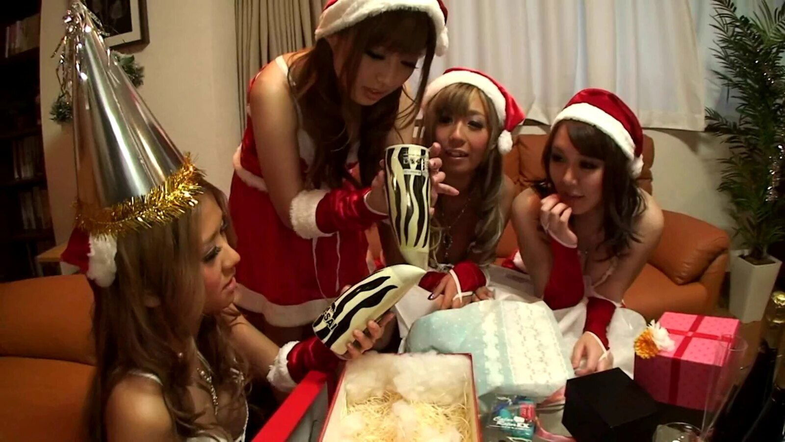 A few horny Santa girls admire a guy with their titjob skills