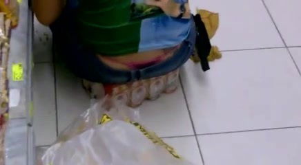 Girl's thong stick out of her jeans in supermarket