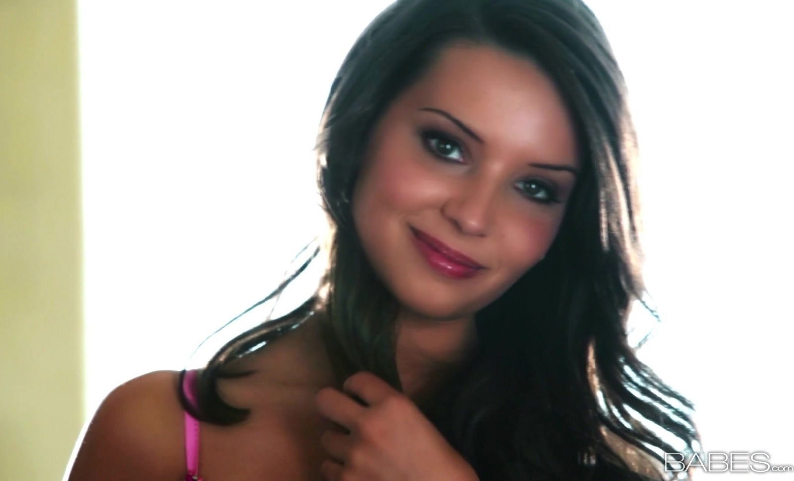 Beautiful Sally Charles plays with shaved pussy