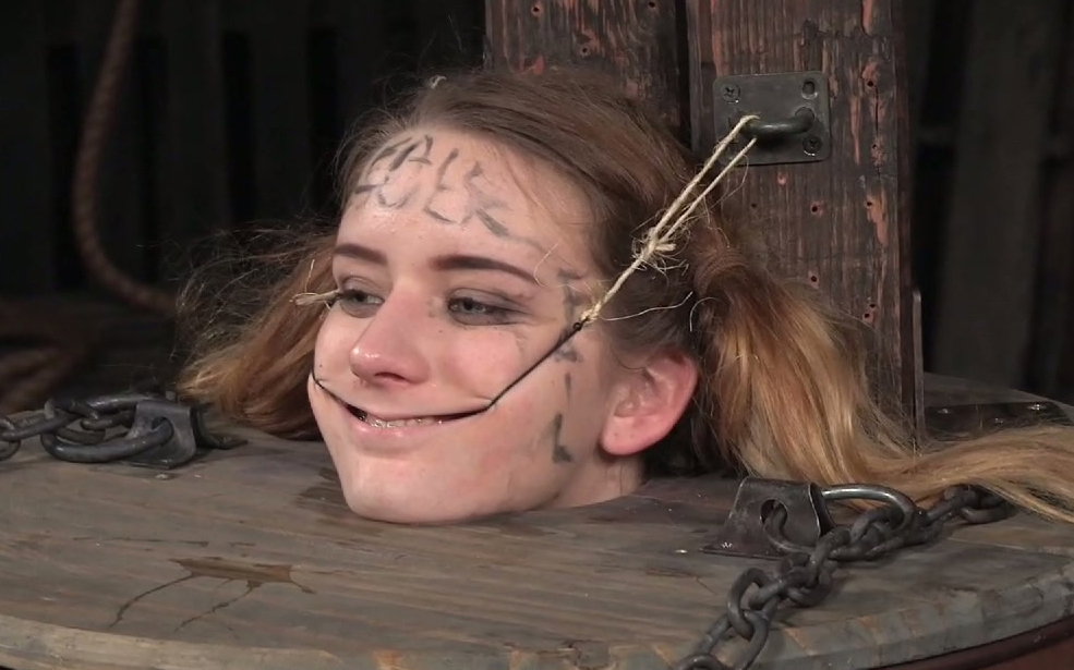 White blonde young whore put in the barrel and fed with chocolate pasta