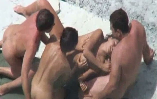 Two local sluts on the beach with two men having foursome
