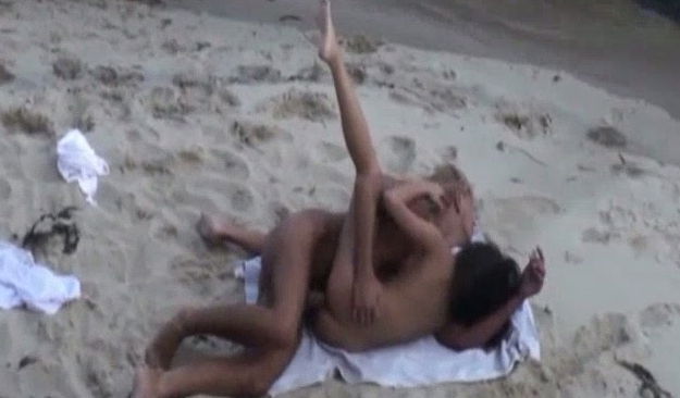Amazing sex of a young white couple on the nude beach