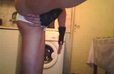 Kinky chick wearing panties rubs her ass in a bathroom