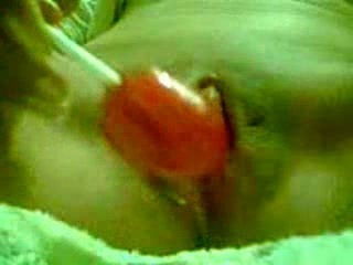 Sweet cherry lollipop moves down shaved meaty pussy