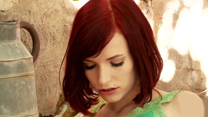 Alluring redhead Leila Smith outdoors