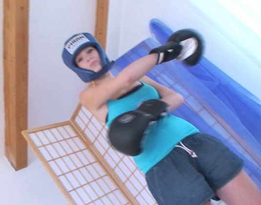 Sporty teen with tanned body shows off her big plump tits