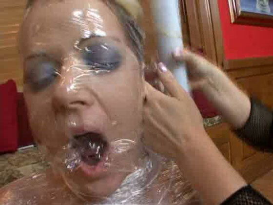 Submissive babe Anita gets wrapped in plastic by kinky mistress