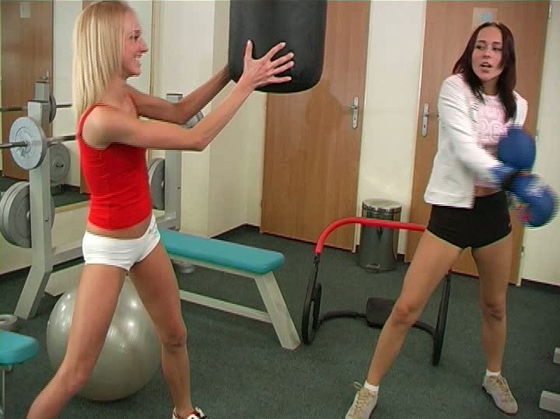 Two boxing girls kissing and licking each other