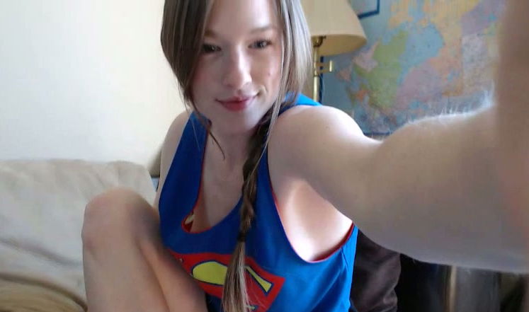 Sweet girl in Super man t-shirt Gemma Minx paints her toes