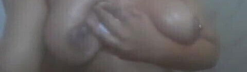 Indian girl playing with her boobs in the shower
