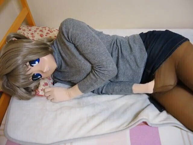 kigurumi touching herself on bed 