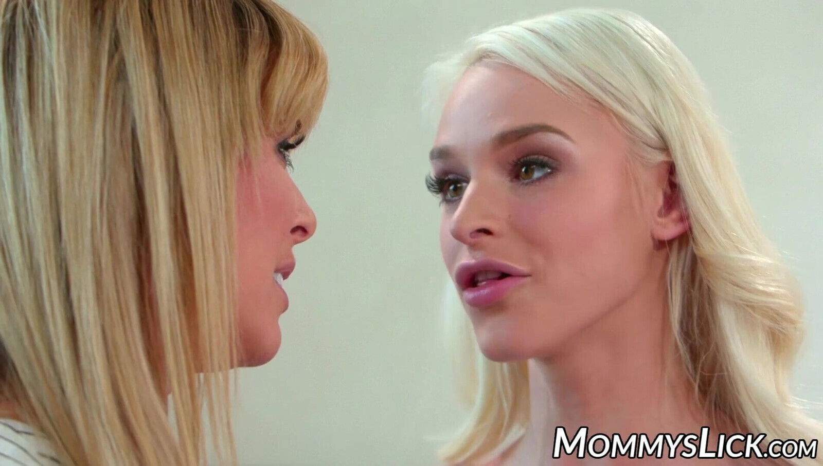 MILF seduced by stepdaughter into erotic lesbian sex