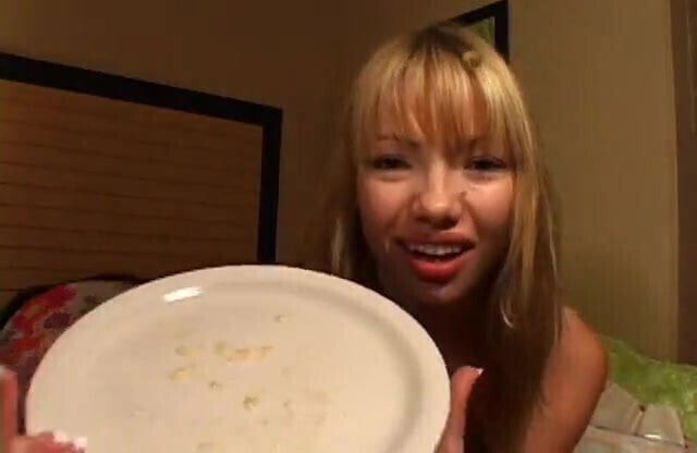 Beautiful Asian girl spits phlegm plate shows